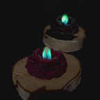 Film przedstawia rozane swiece w ksztalcie rozy z kolorowym plomieniem na drewnianych krazkach